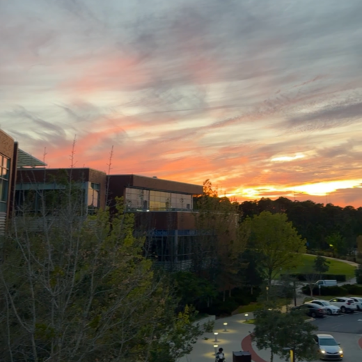 photo of orange sunset over the student union