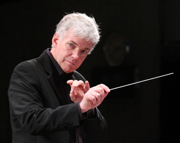 Man holding a conducting baton