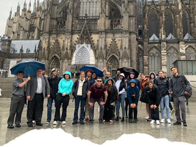 students in front of a cathedral in Belgium
