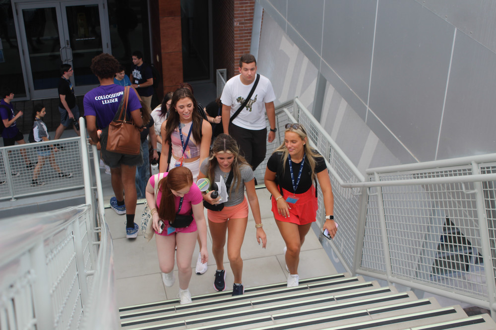 Students walking up stairs at the Student Union. 