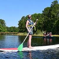 student on a paddleboard