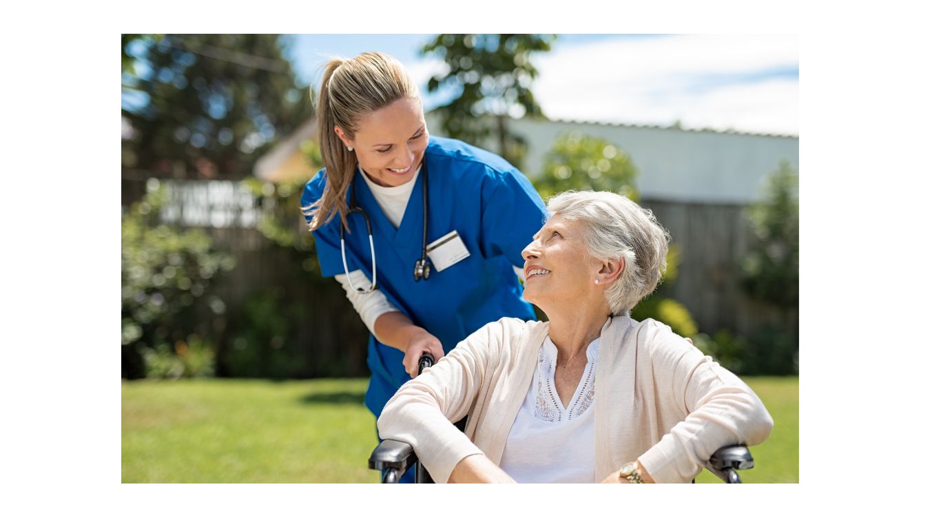 Woman in healthcare pushing female patient in wheelchair