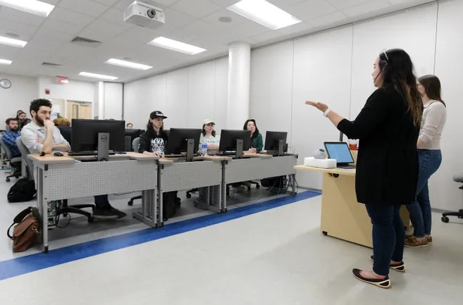UNF Professor instructing students in computer lab