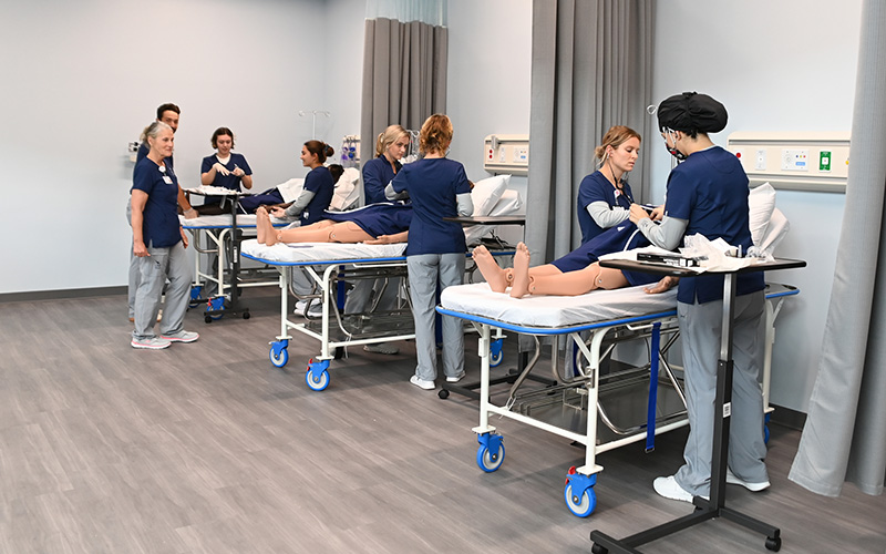 Group of students working in the Sim Lab