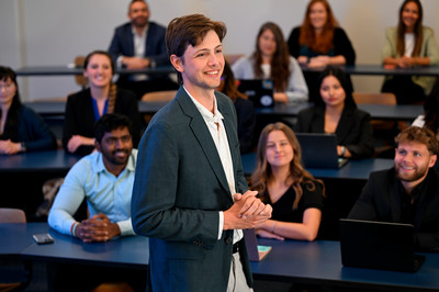 Student standing in front of class 