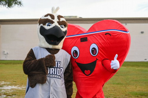 Ozzie mascot with Heart Walk mascot