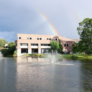 Coggin college of business building with a rainbow 