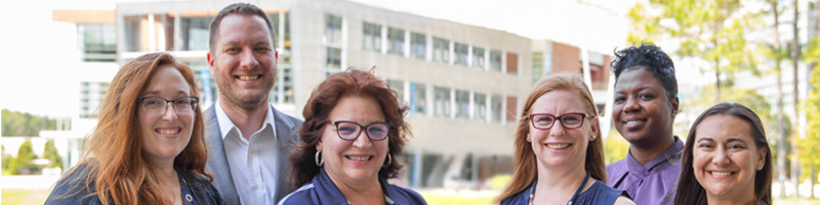 Coggin College of Business Advisors smiling on a sunny day 