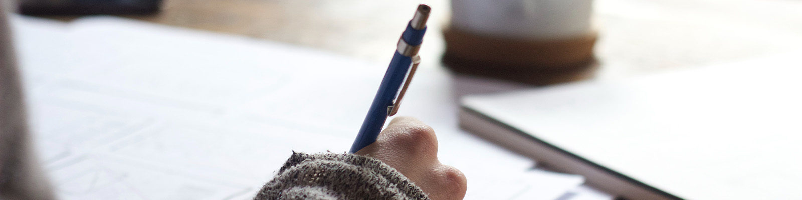 Student studying holding a mechanical pencil