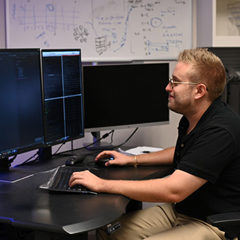 Conrad Testagrose sitting at a computer