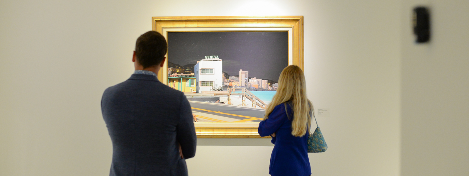 two museum visitors are looking at a piece of art at MOCA