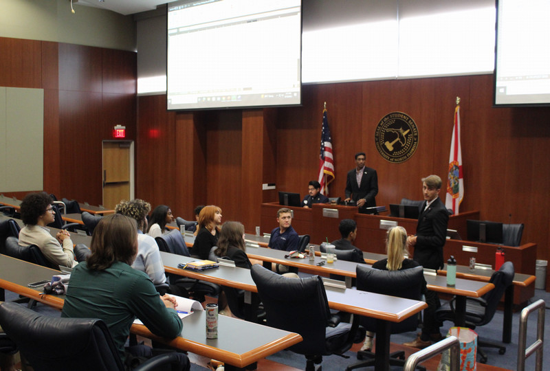 students holding a meeting in the student government chambers