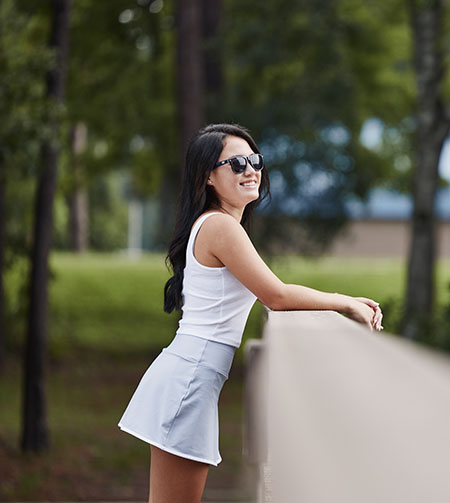 girl in sunglasses smiling