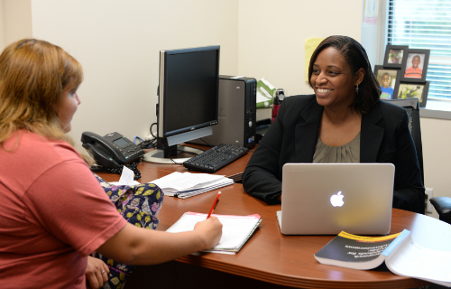 Two women at a desk