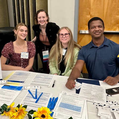 4 public health students at a table