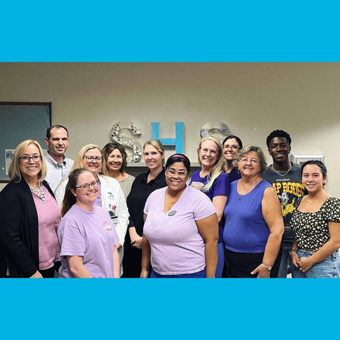 Student Health Services wearing purple