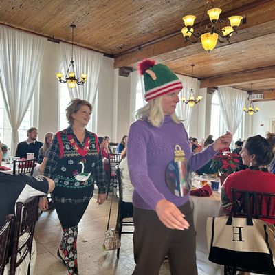 Faculty wearing ugly christmas sweaters for a contest