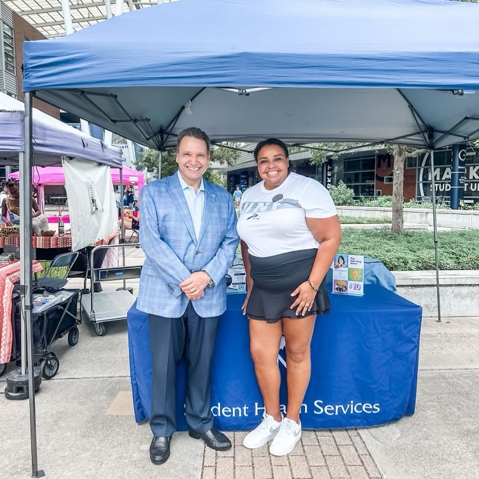 UNF President Limayem with SHS staff at Market Day