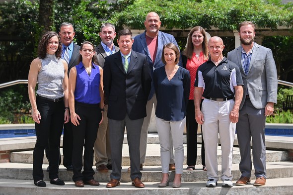 Cams faculty group picture in front of osprey fountain