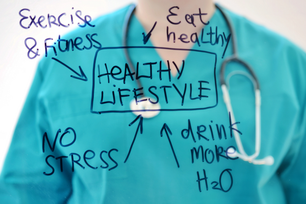 healthy lifestyle image with person in the back with a stethoscope