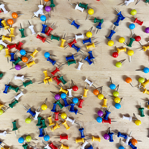 push pins on a table