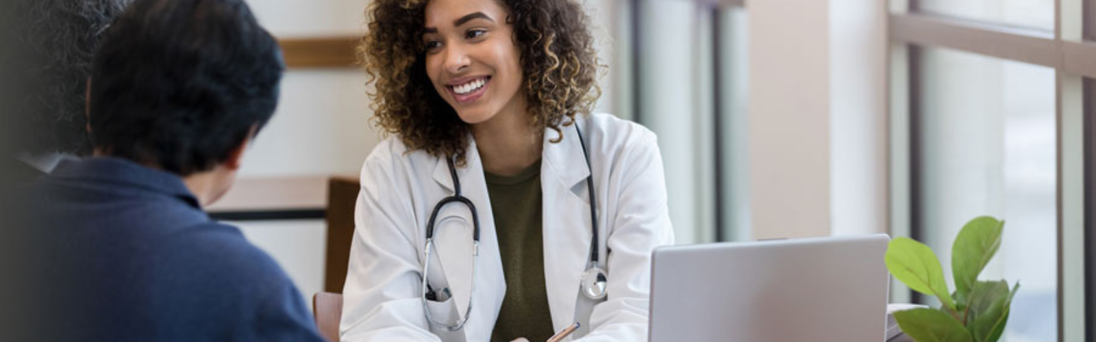 Nurse smiling at patients 