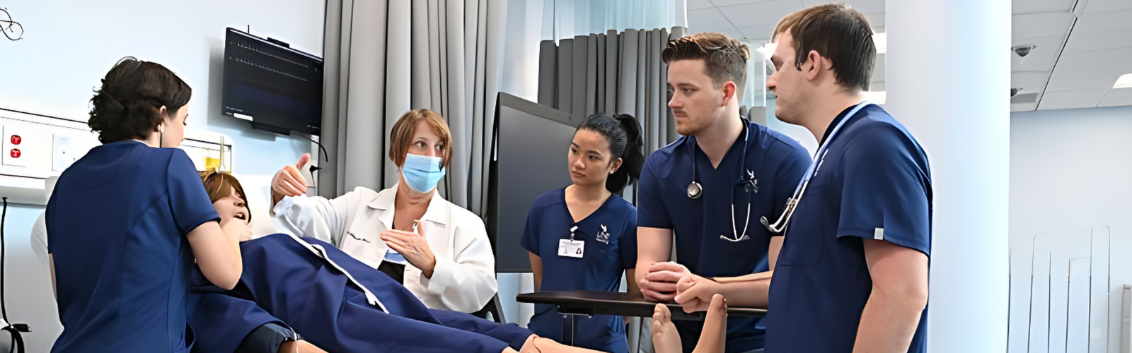 Four nursing students and a nursing faculty learning about the cadavers