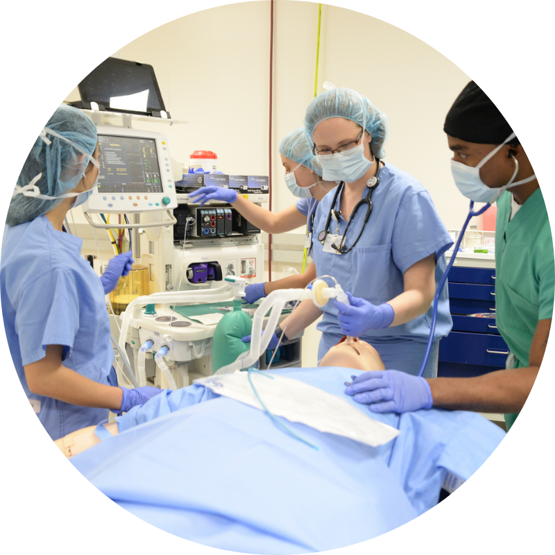 Three nurses working on a cadaver