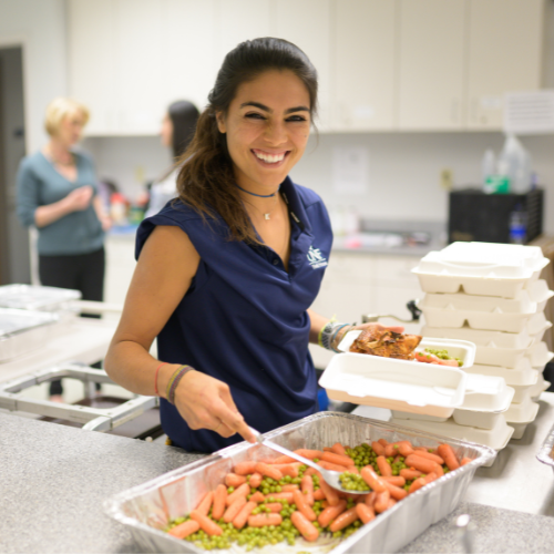 volunteer making meals