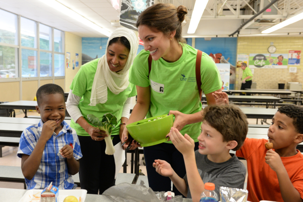 students teaching nutrition education to kids