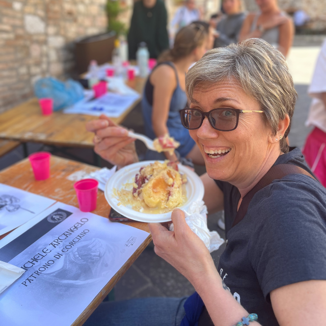 Faculty member enjoying local cuisine outdoors