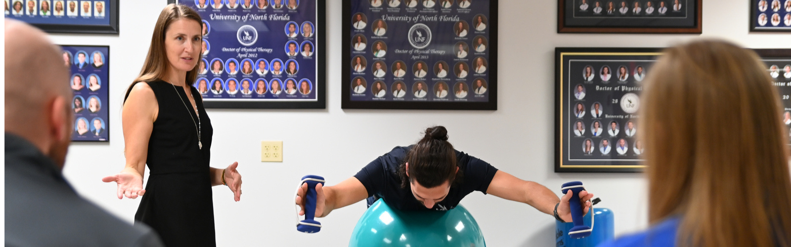 Doctor of Physical Therapy talking to a group about ball balancing technique