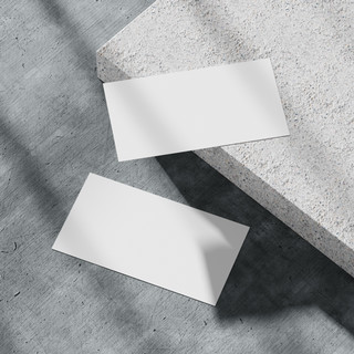 blank white business card on the concrete