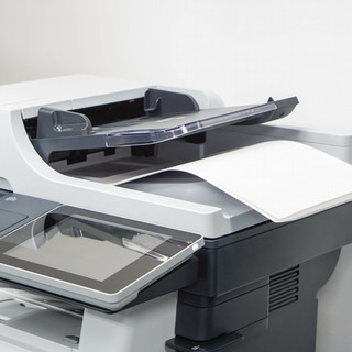 close up paper sheets on the printer in office