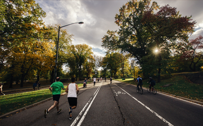 a group of people running on a road