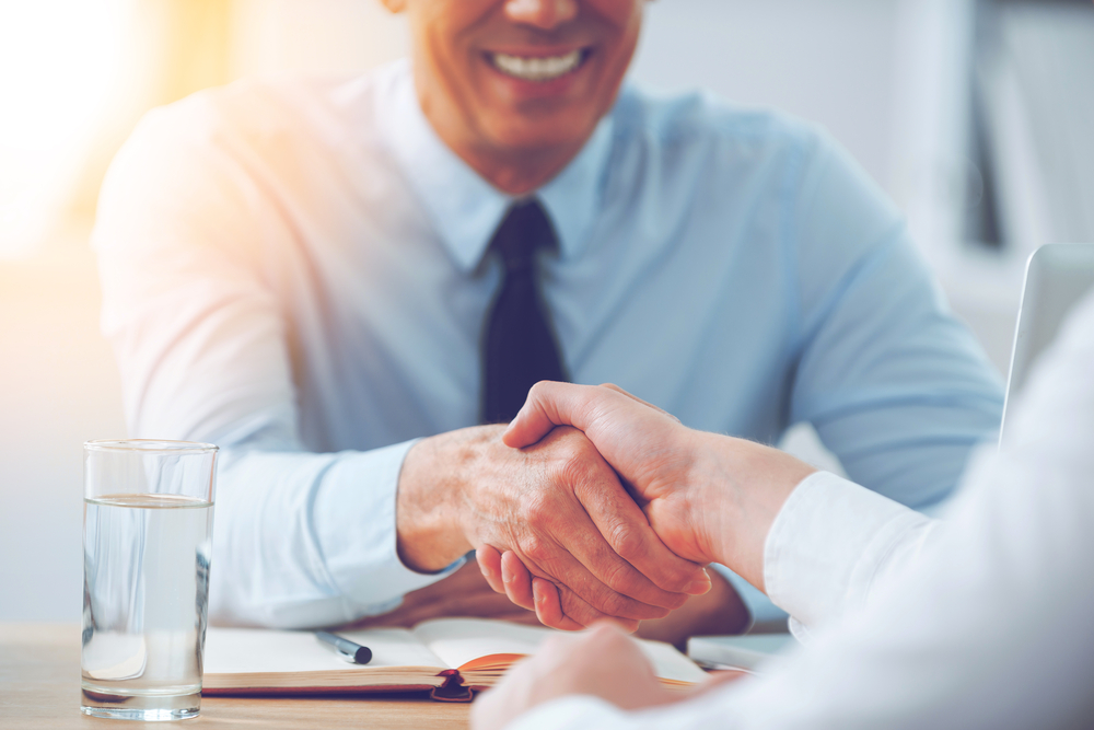 two people shaking hands