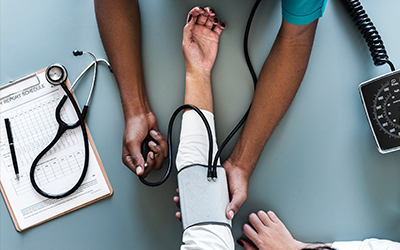 nurse taking blood pressure