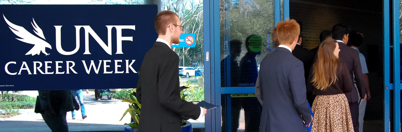 Students walking into career week dressed up. 