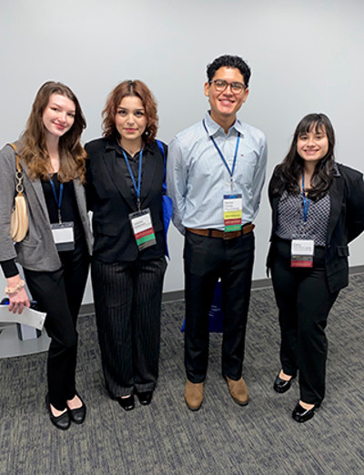 four students standing together at a Career Services event