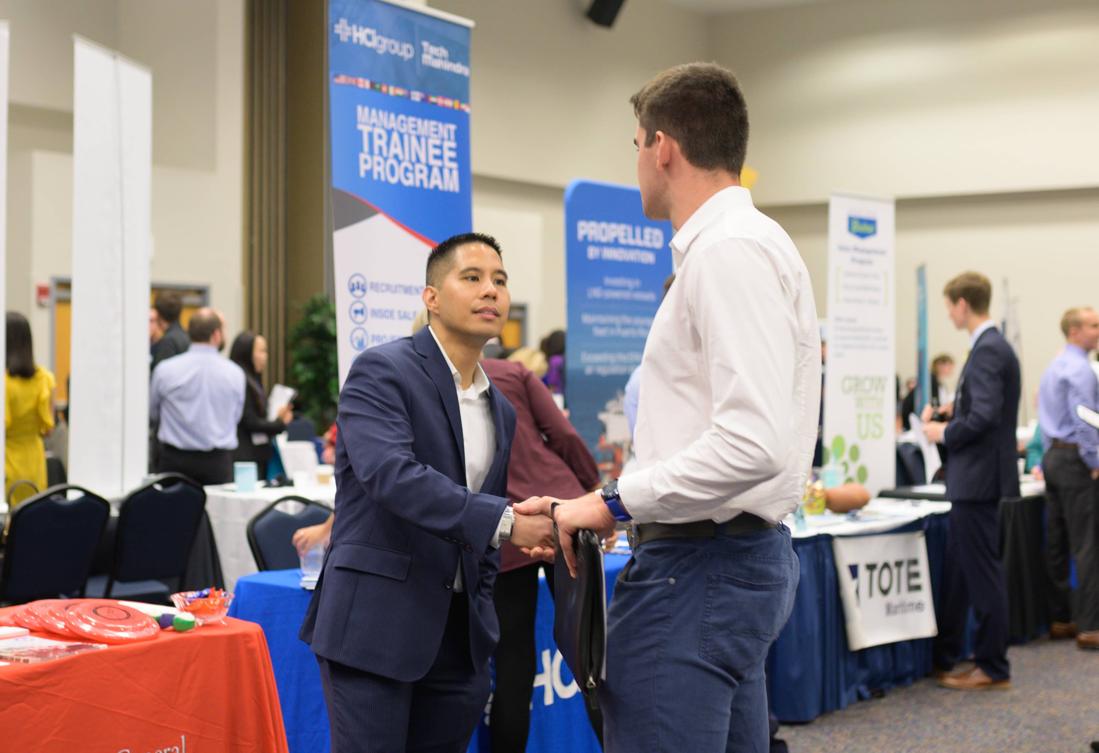 Two people shaking hands at the career fair