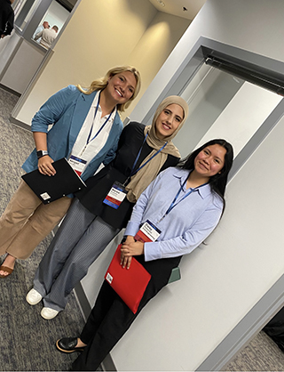 three students standing together at a Career Services event