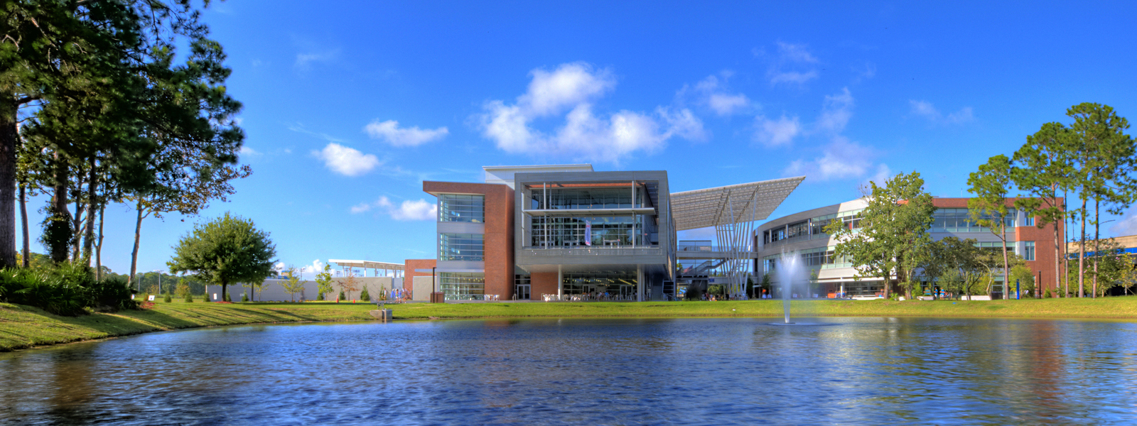 UNF Student Union is viewed across a lake.