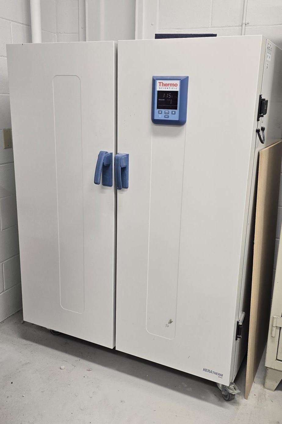 Tall white laboratory drying oven with digital temperature control