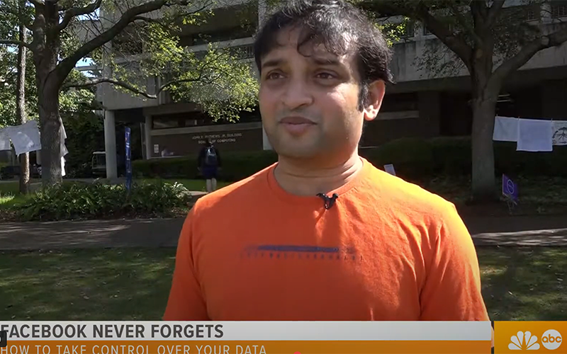 Dr. Roy Swapnoneel in front of college building giving an interview.