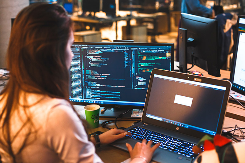 student at a computer working