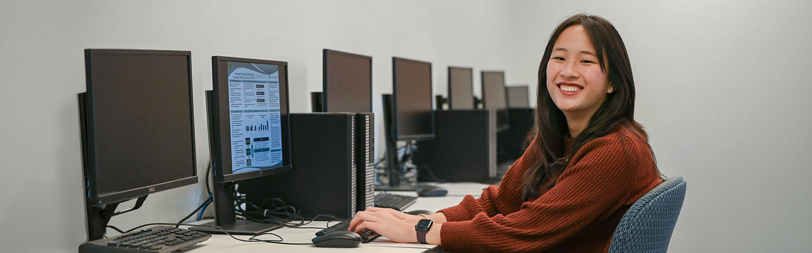 student on a computer typing