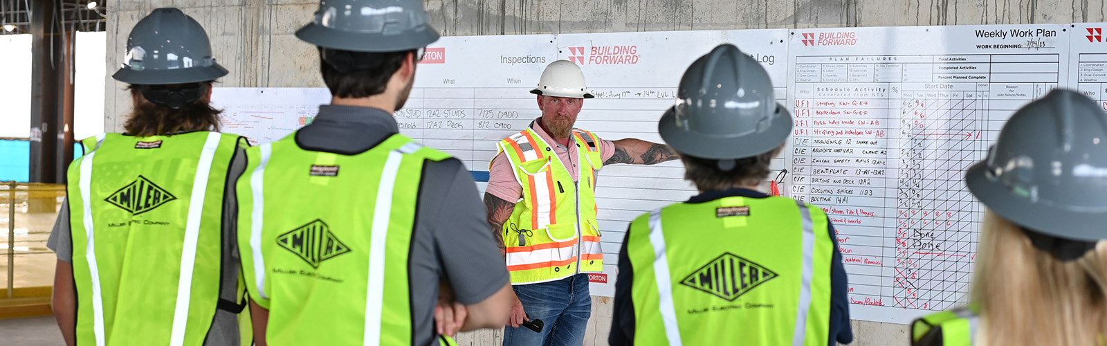 four construction management students and a manager at the Mayo Clinic construction site