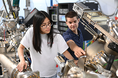 student and instructor working on a project
