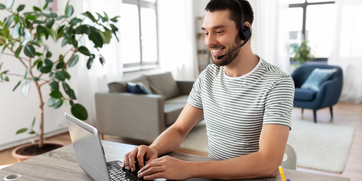 Man with headset learning online