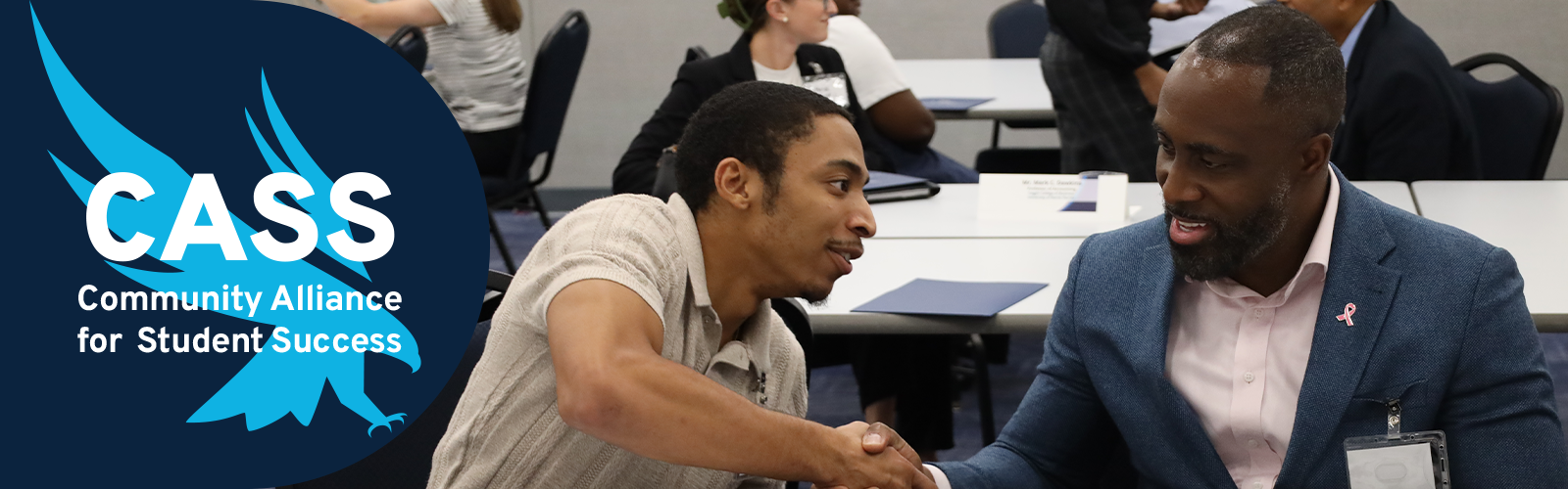 Mentee and mentor giving a hand shack to each other and the CASS logo to the left